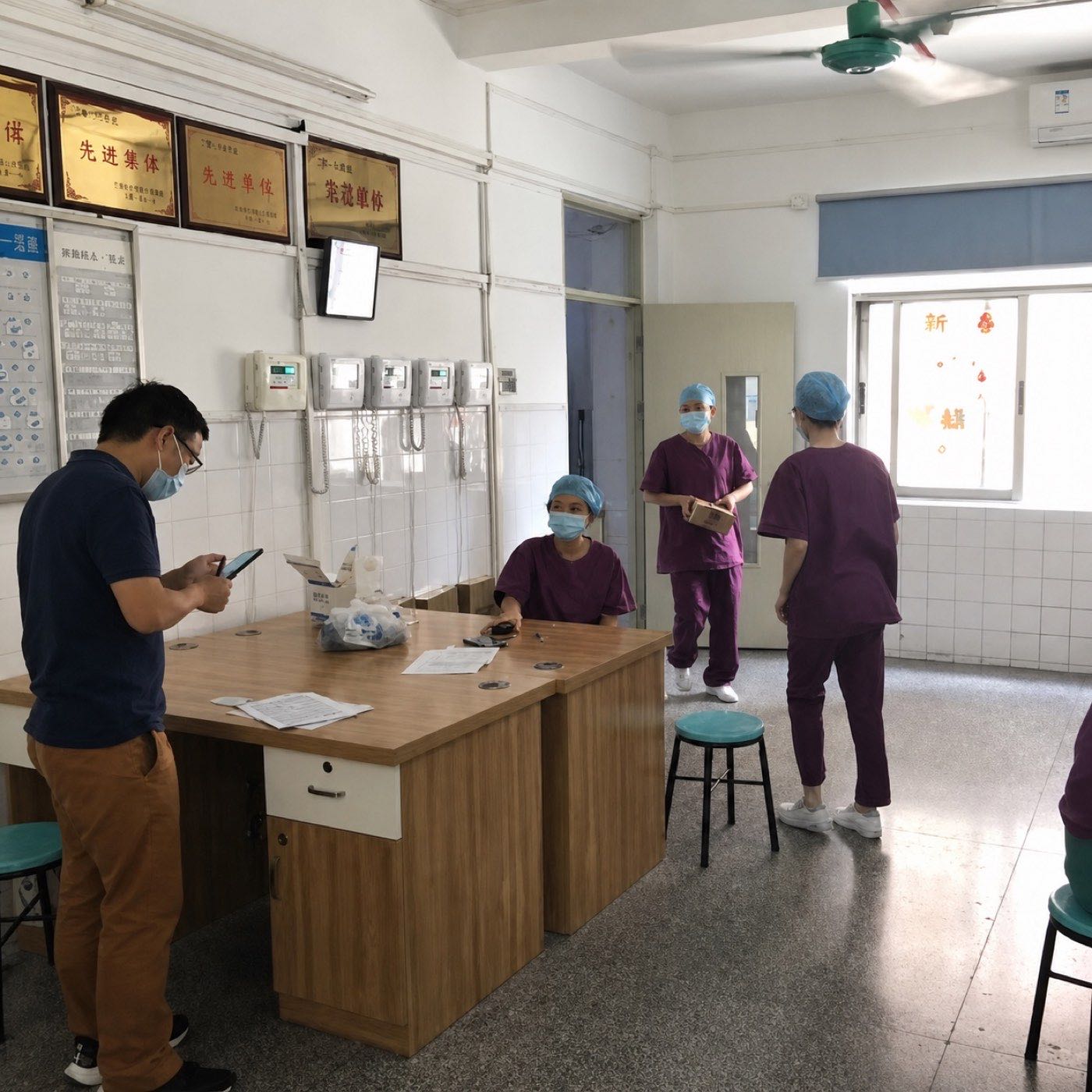 OnCorva team verifying temperature monitoring equipment with staff at a Guangzhou location